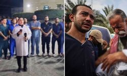 Gazze'deki doktorlar hastane önünde toplanarak "Burada Kalacağız" isimli ezgiyi okudu